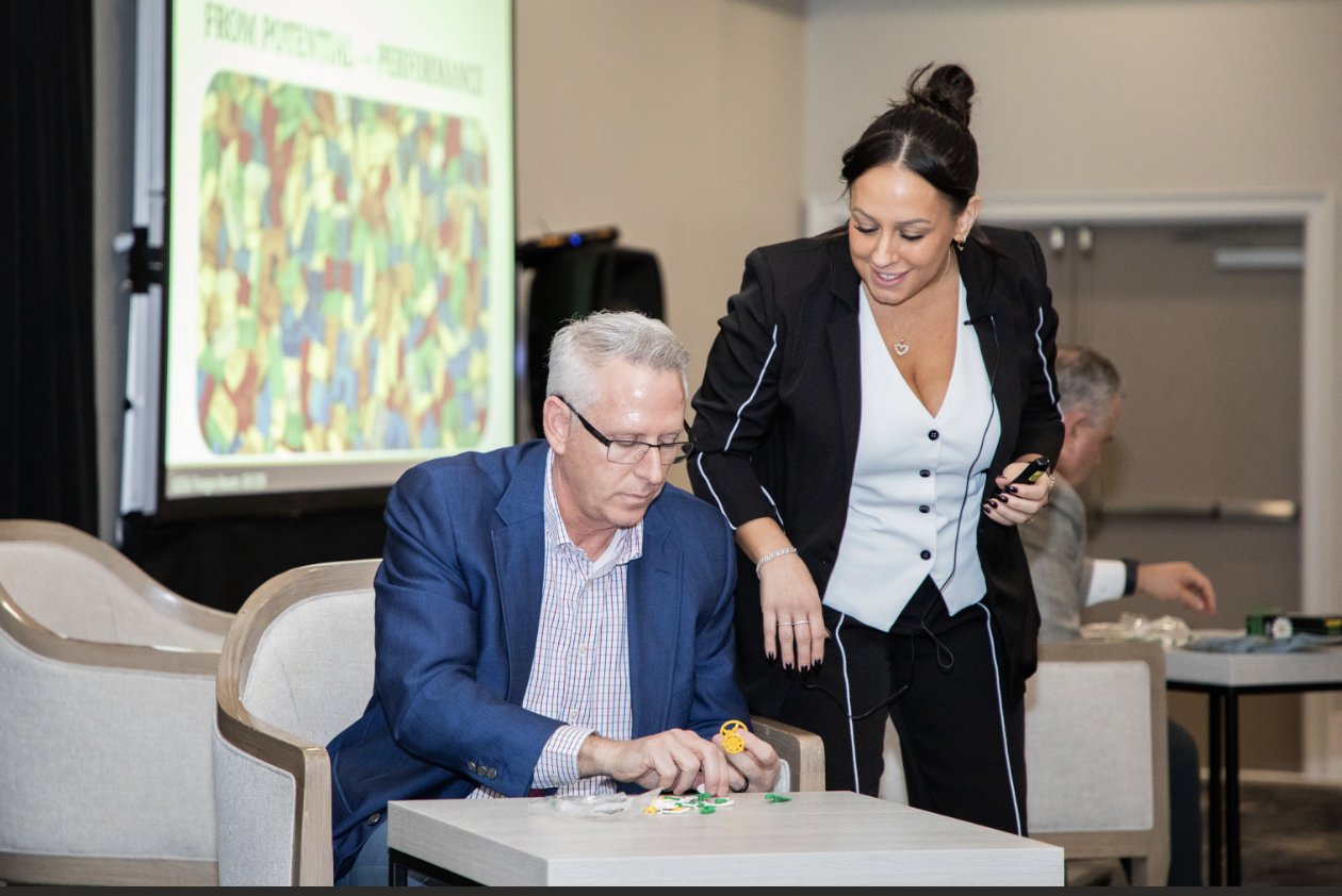 Steph guiding a participant through a hands-on activity