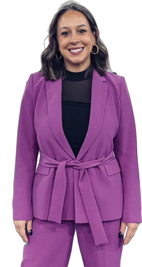 Steph Ketron in a purple suit, smiling